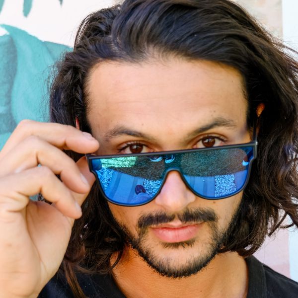 CANNON BALL Polarised Blue Mirrored Shield Sunglasses close up on a male model