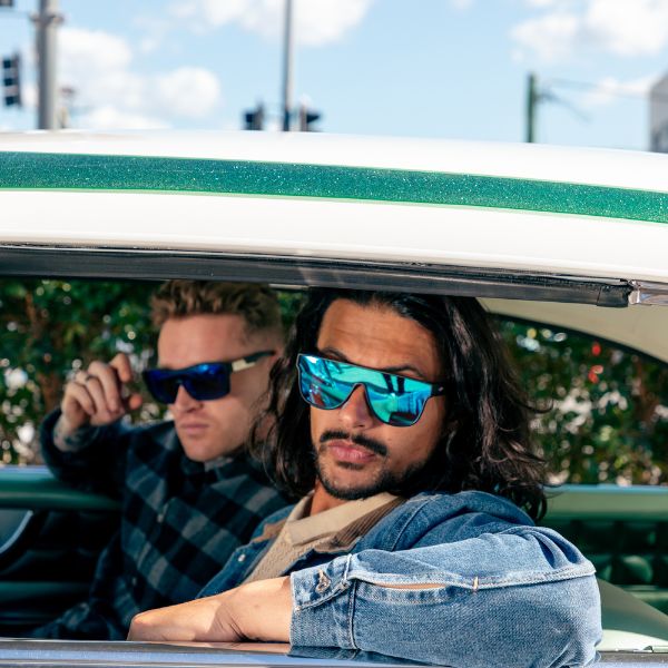 CANNON BALL Polarised Shield Sunglasses with Blue Mirror on a male model sitting in a classic car