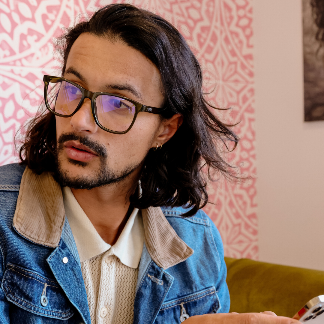 Game Changer Square Blue Light Glasses with Green Frame left side view on a male model