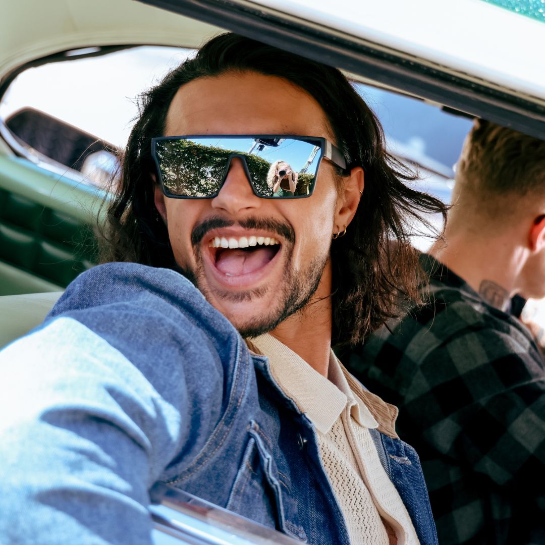 LOOSE CANNON Polarised Silver Shield Square Sunglasses on a male model