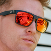 Peccant Polarised Black Rectangle Sunglasses with Red Lens right side view on a male model