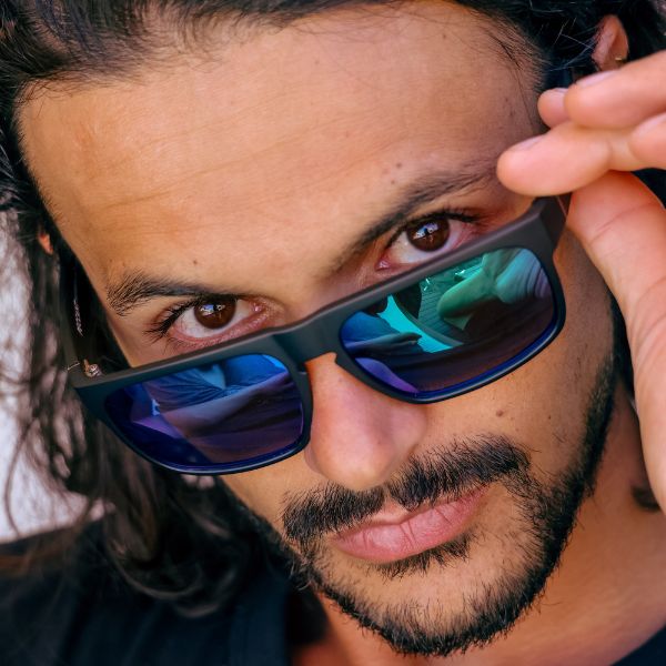 Peccant Polarised Rectangle Sunglasses with Black XL Frame and Blue Lens on a male model
