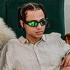 Reefer Polarised Black and Green Wrap Around Sunglasses made of recycled plastic on male model