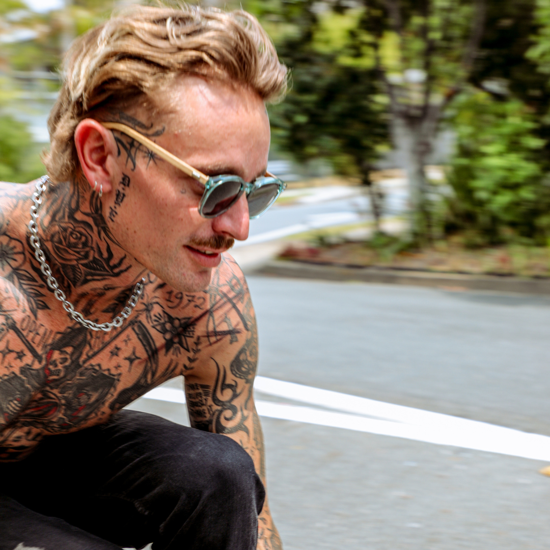 Risky Business Polarised Blue Round Wooden Sunglasses on a male skateboarder