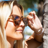 Risky Business Polarised Brown Round Wooden Sunglasses left view on female model