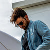 Risky Business Polarised Tortoise Shell Round Wooden Sunglasses on a male surfer looking down