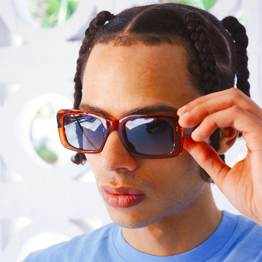 Rocker Polarised Brown Rectangle Sunglasses on a male model