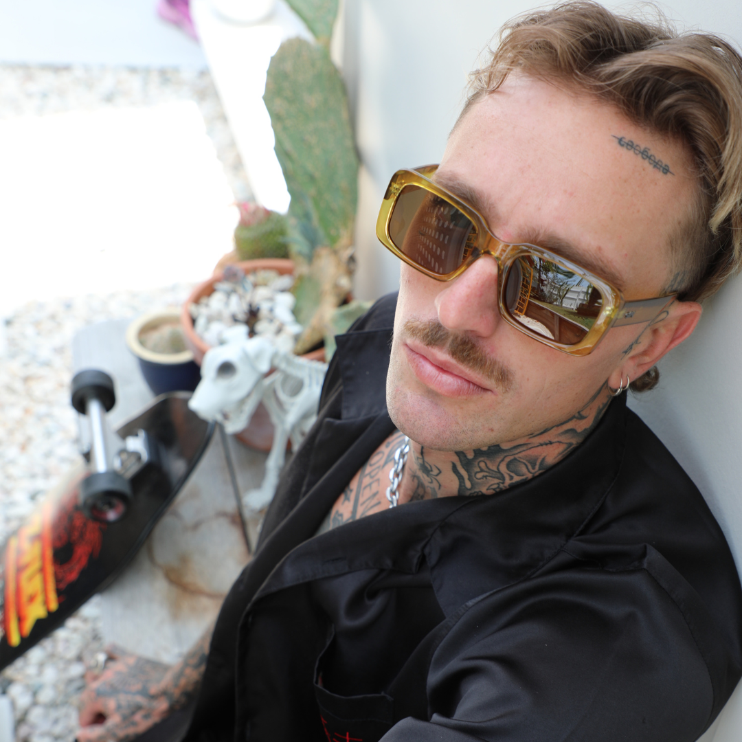 Rocker Polarised Green Rectangle Sunglasses on a male model