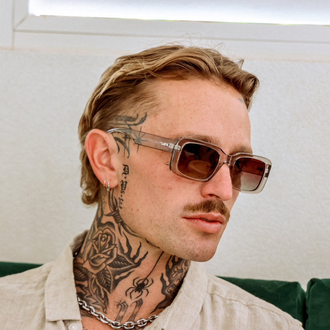 Rocker Polarised Grey Rectangle Sunglasses on a male model