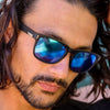 Spartan Recycled Black Rectangle Sunglasses with blue matte lens on a male model