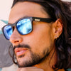 Spartan Recycled Black Rectangle Sunglasses with blue matte lens side view on a male model