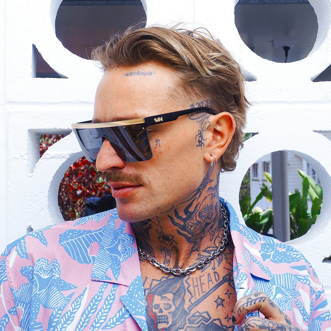 THE BAR Polarised Black Matt Gold Square Sunglasses on a blonde male model looking towards the right