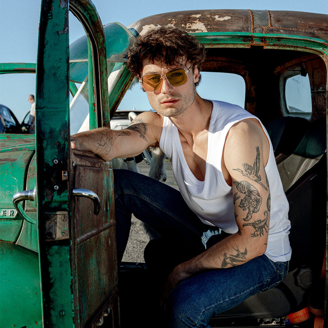 The Duke Crystal Sand Brown worn by male model in car