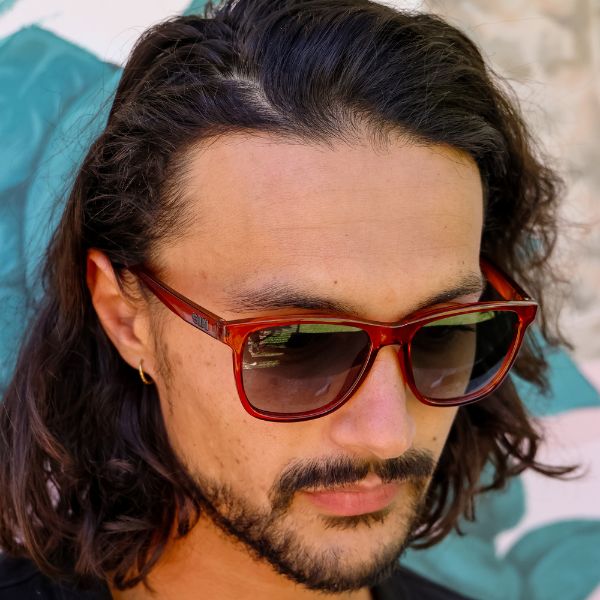 The Game Changer Polarised Brown Square Sunglasses close up on a male model