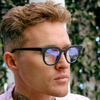 Vegas Round Blue Light Glasses with Black Frame side view on a blonde male model