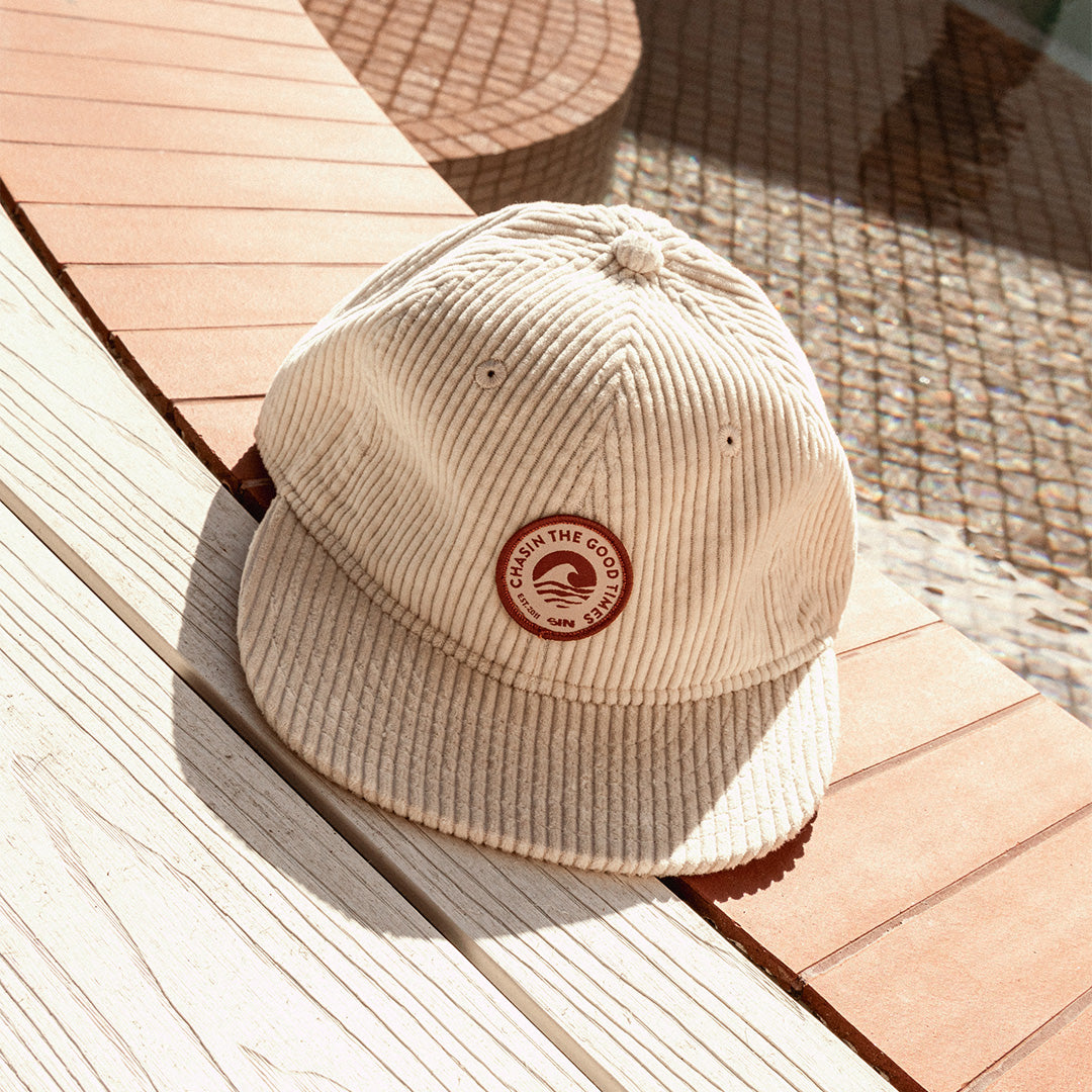 Chasin The Good Times Wave Corduroy Cap beside pool