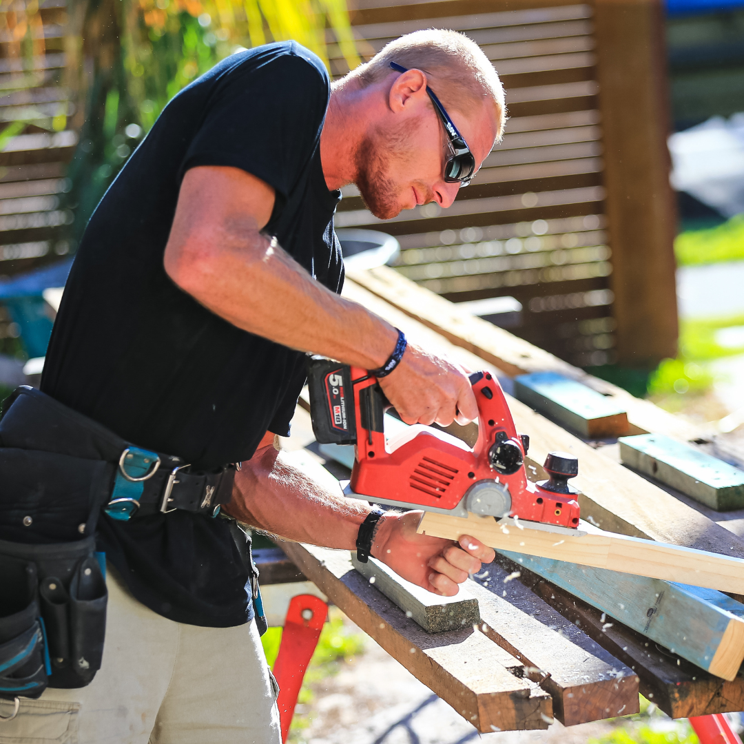 Captain Sensible Black Wrap Around Safety Sunglasses Medium Impact Resistant on a Male Tradie