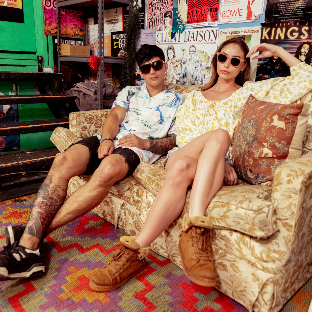 JACKPOT Polarised Tort Shield Sunglasses on a male model sitting on a couch
