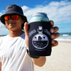 Ocean Potion Black Can Stubby Cooler held by a male surfer