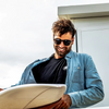 Risky Business Polarised Tortoise Shell Round Wooden Sunglasses on a male surfer