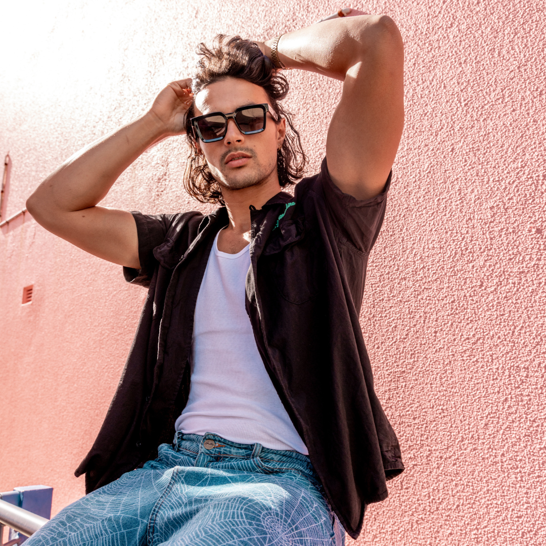 Topshelf Polarised Black Square Sunglasses on a male model tying his hair