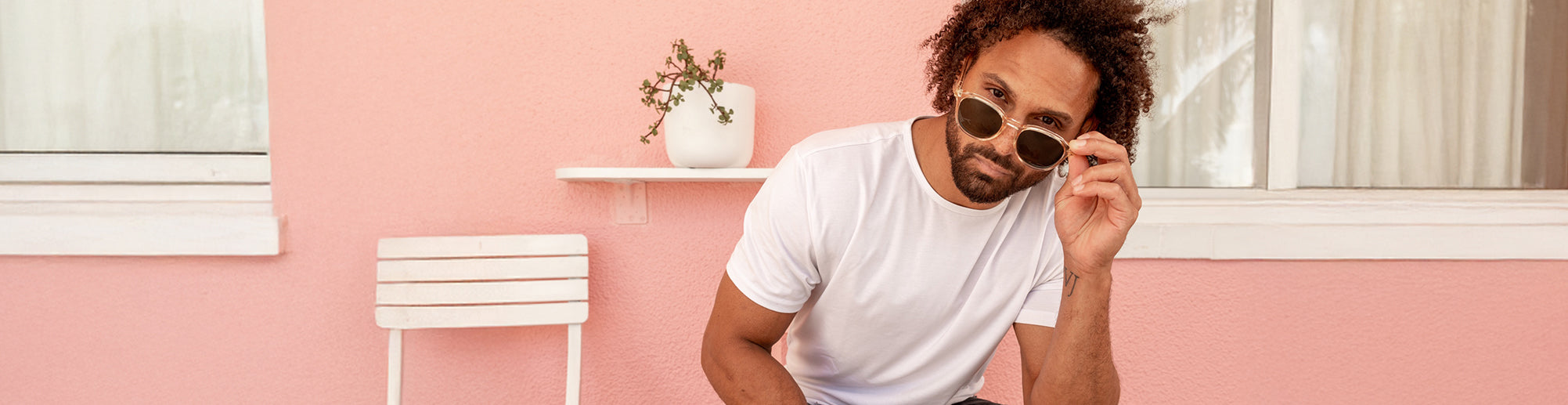 male model wearing round sunglasses