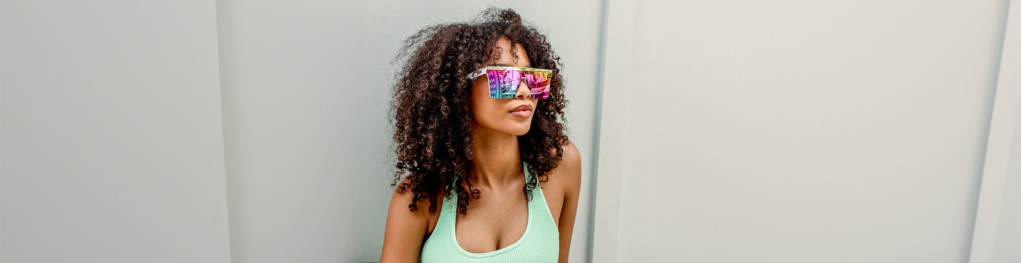 female model wearing purple sunglasses