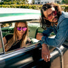 CANNON BALL Polarised Pink Mirrored Shield Sunglasses on a female model sitting in a classic car