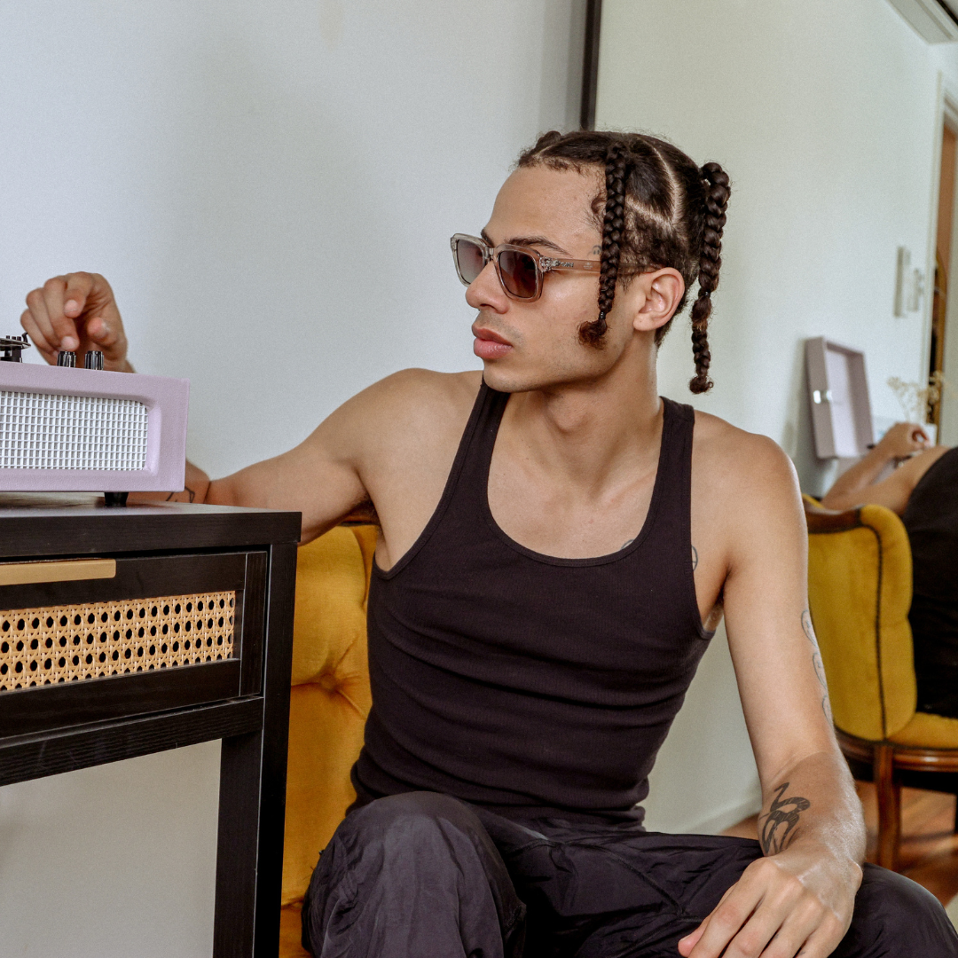 Chiller Polarised Grey Square Sunglasses on a male model next to a record player