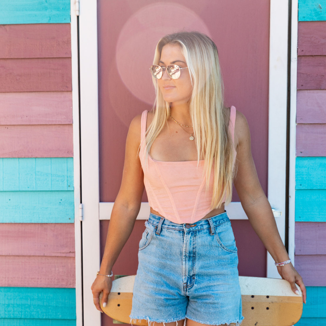Gunner Polarised Rose Gold Aviator Sunglasses on a blonde female model