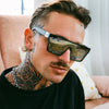 LOOSE CANNON Polarised Silver Shield Square Sunglasses on a male model looking side on