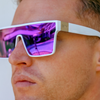 LOOSE CANNON Polarised White Shield Square Sunglasses with Purple Mirrored Lens left side view on a male model