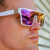 LOOSE CANNON Polarised White Shield Square Sunglasses with Purple Mirrored Lens right side view on a male model