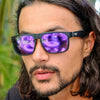 Peccant Black Rectangle Sunglasses with purple matte lens on a male model