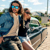 Peccant XL Polarised Black Rectangle Mens Sunglasses with Blue Lens on a male model leaning on a classic car