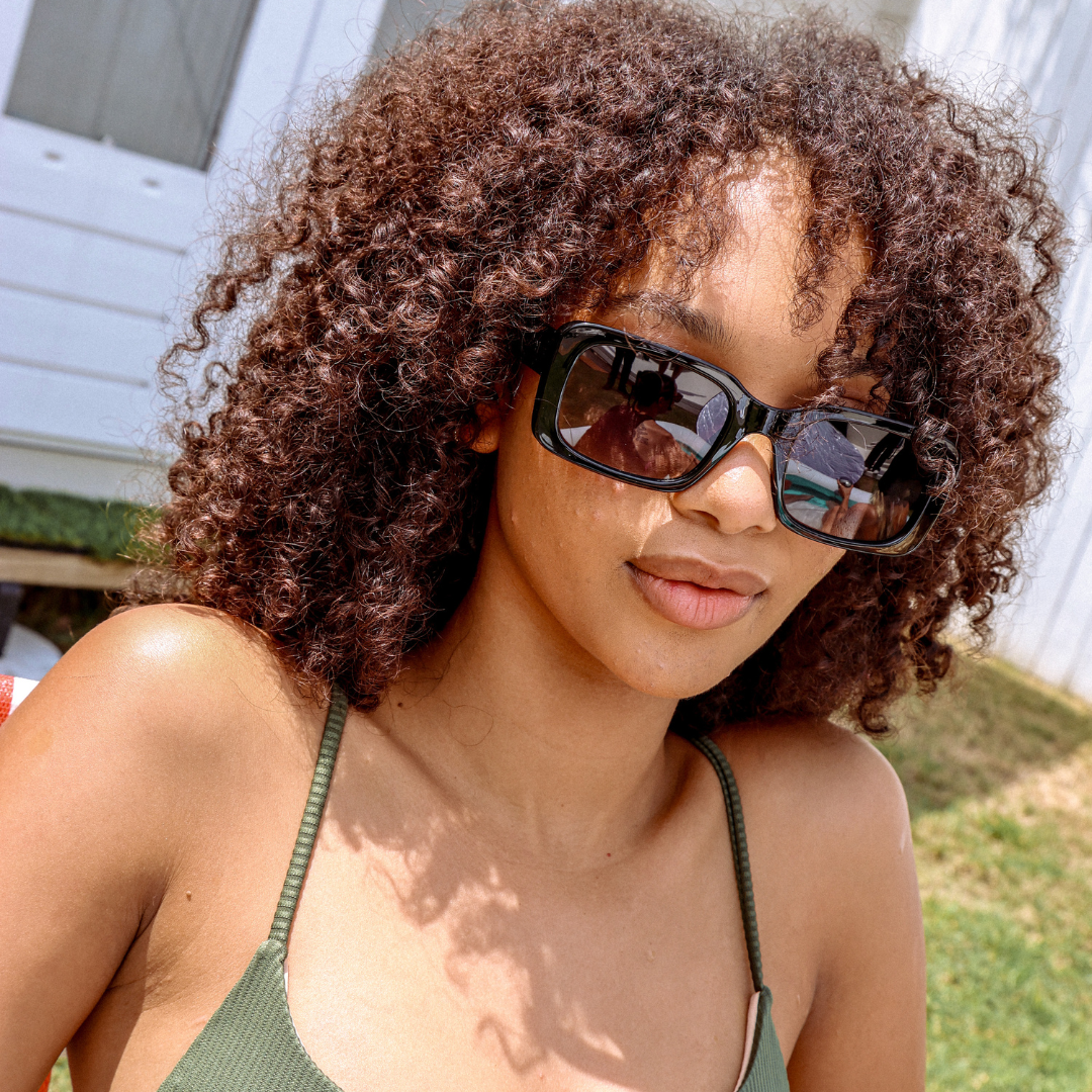 Rocker Polarised Black Rectangle Sunglasses on a female model