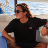 THE BOSS Polarised Black Aviator Sunglasses on a male surfer