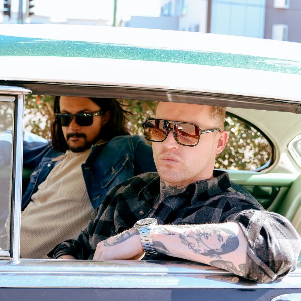 THE DUKE Aviator Sunglasses with Black Frame and Brown lens on a male model