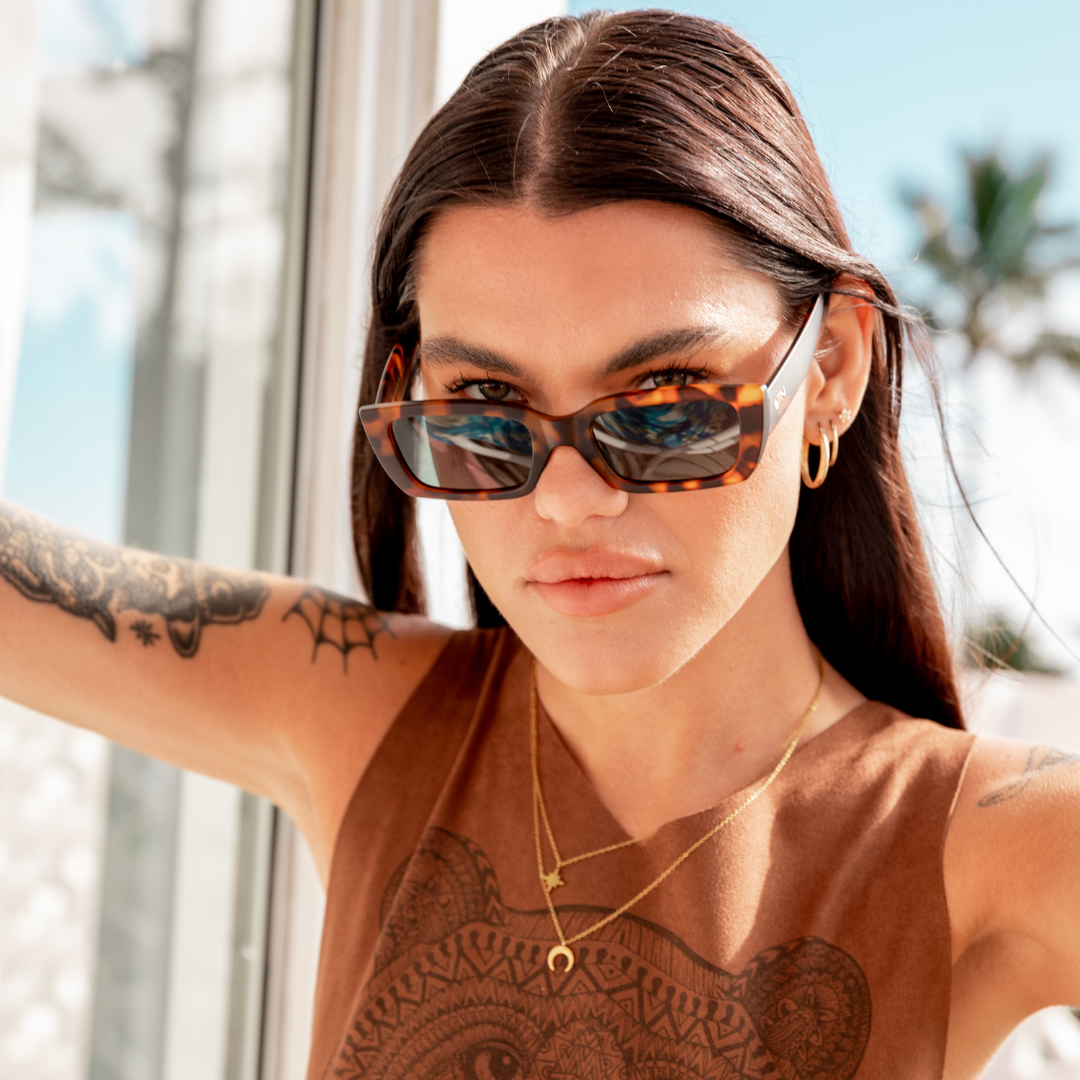 Ahoy Polarised Tort Rectangle Sunglasses on a female model