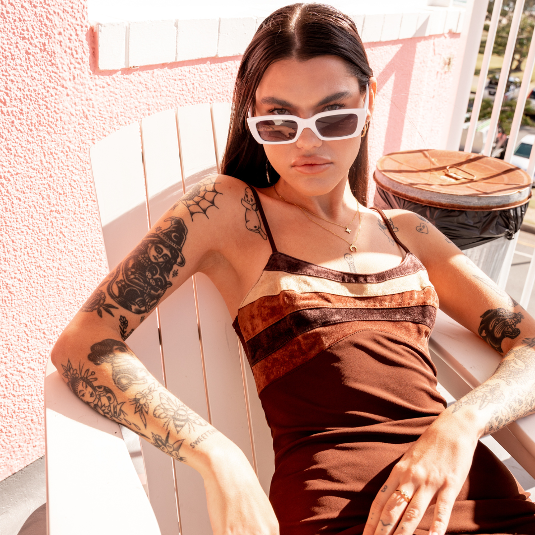 Ahoy Polarised White Rectangle Sunglasses on a brunette female model