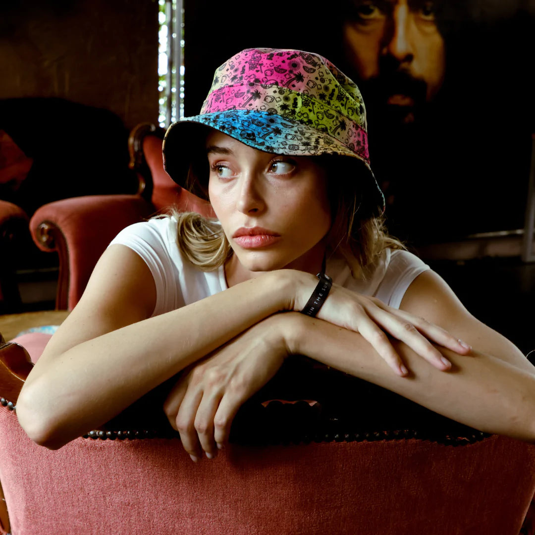Fresh Prints Reversible Bucket Hat on a female model