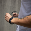 Game Changer Recycled Fabric Wristband on a male model's arm
