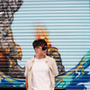 JACKPOT Polarised Black Shield Sunglasses side view on a male model in front of a graffiti wall