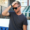 LOOSE CANNON Polarised Black Shield Square Sunglasses on a male model