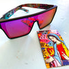 LOOSE CANNON Polarised Shield Square Sunglasses with Black Frame and Pink Mirrored Lens next to a colourful card