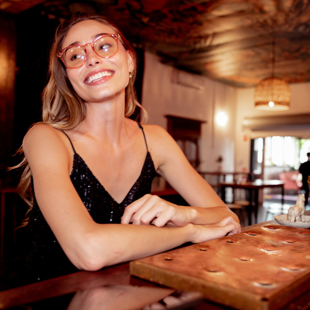 Love Child Pink Round Blue Light Glasses on a female model