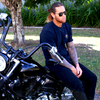 Maverick Polarised Black Aviator Sunglasses on a male model sitting on a motorcycle