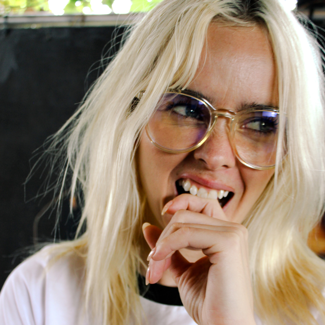 Risky Business Clear Frame Champagne Round Blue Light Glasses on a female model
