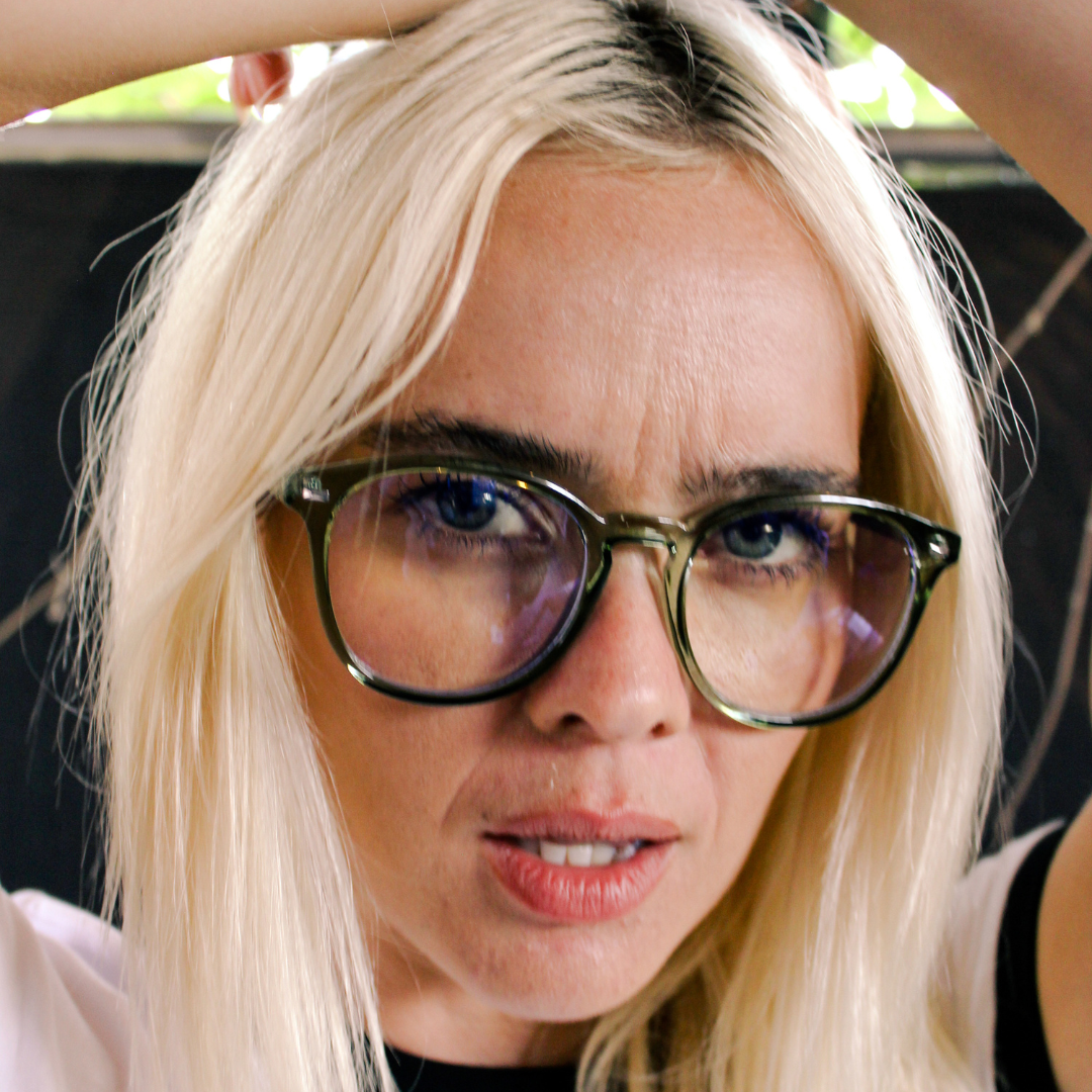 Risky Business Clear Frame Green Round Blue Light Glasses on a female model