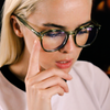 Risky Business Clear Frame Green Round Blue Light Glasses on a female model looking down